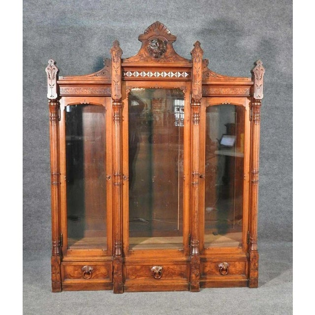 An exceptional masterpiece of American Victorian cabinetmaking, this three-door bookcase is attributed to the renowned...