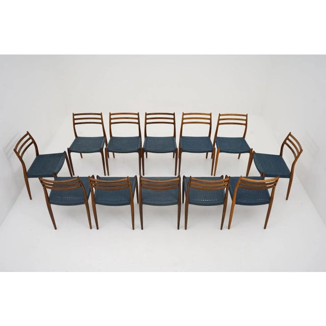 Rare set of 12 Scandinavian Mid-Century dining chairs model 78 by Niels Otto Møller, Denmark. These sculptural rosewood...