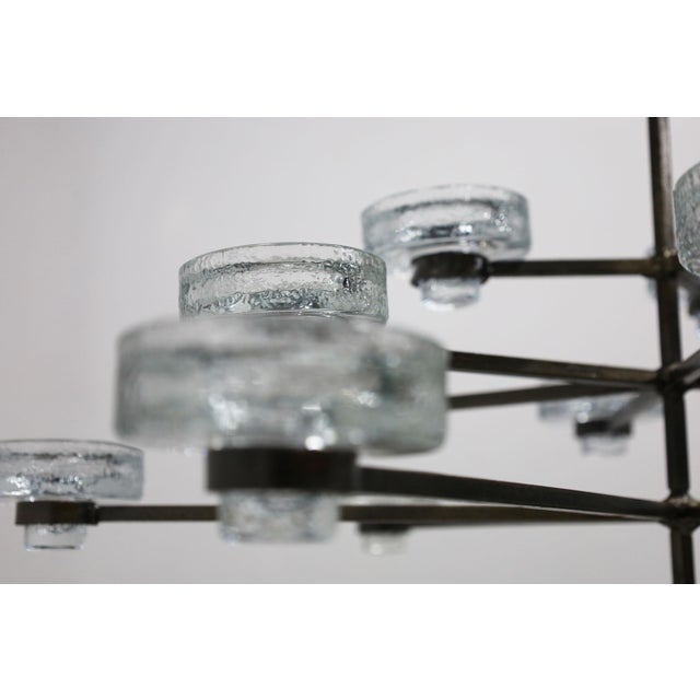 Elevate your home decor with the gorgeous 15-candle chandelier by Erik Hoglund for Kosta Boda, circa 1960s. Expertly...
