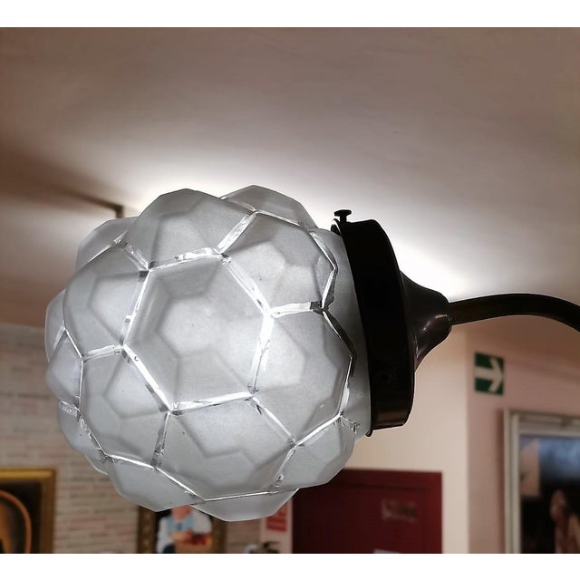 Original vintage ceiling lamp in perfect condition. Dark bronze metal frame with four curved arms. Four spherical glass...