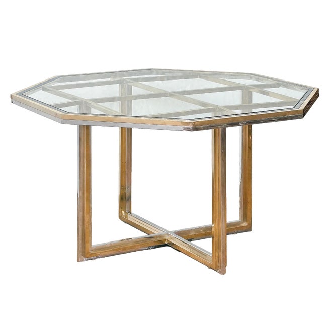 A fine center or dining table from Italy in the Hollywood Regency or Modern style, featuring an octagonal glass top over...