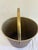 Vintage Mid-Century wastebasket featuring a faux woodgrain exterior with brass-tone interior and matching swing handle....