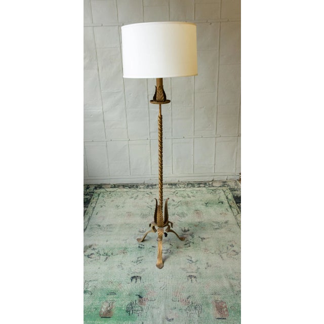 Introducing an exceptional Spanish floor lamp from the 1950s, a unique piece that features a twisted stem and stylized...