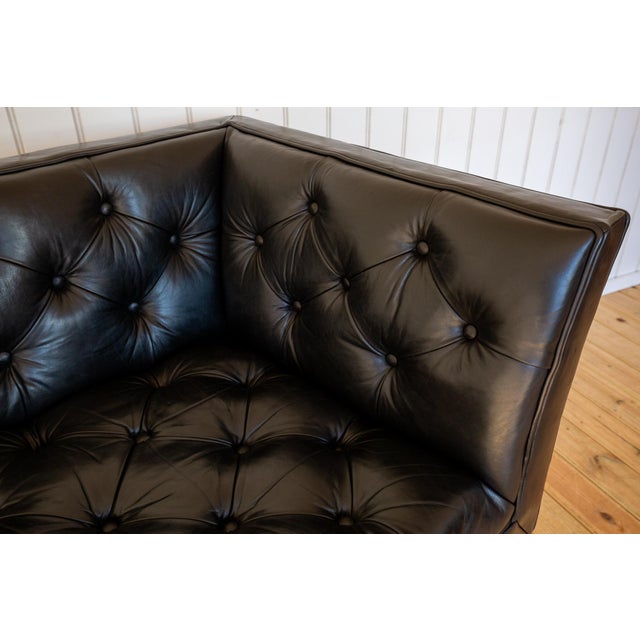 A very rare and strikingly attractive, excellent quality designer chesterfield buttoned leather corner armchair in lovely...