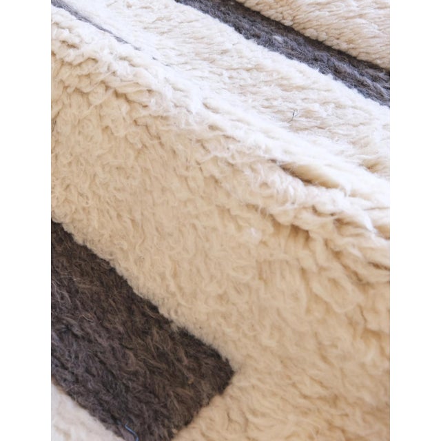 Beni Mrirt Rug | Handwoven Berber Wool Rug with Ivory Field and Charcoal Horizontal Lines This minimalist Beni Mrirt rug...