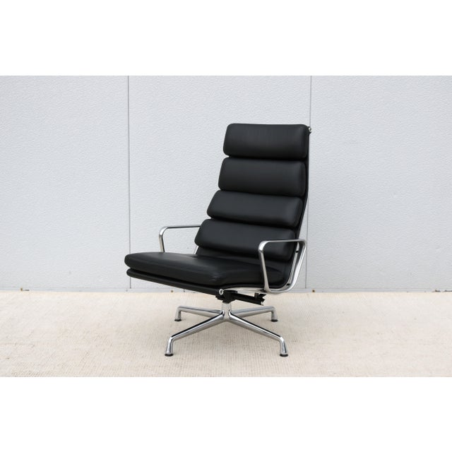 Fabulous mid-century modern authentic Herman Miller Eames soft pad 4 cushions tilt and swivel lounge chair. Designed as...