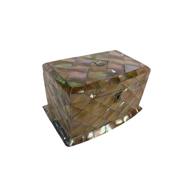 A beautiful Victorian tea caddy clad in luminous mother of pearl with exceptional iridescence and elegant proportions....