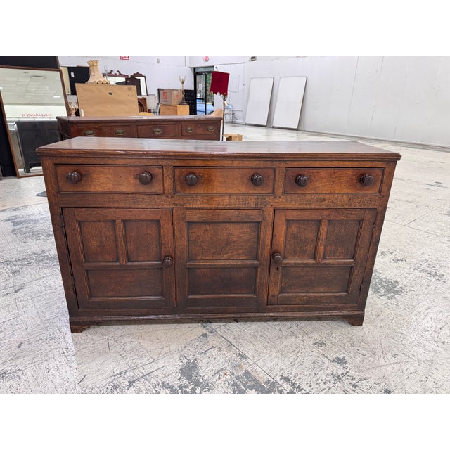 Own a piece of history with this 18th Century English Welsh Dresser Base. Crafted with timeless charm, this antique...