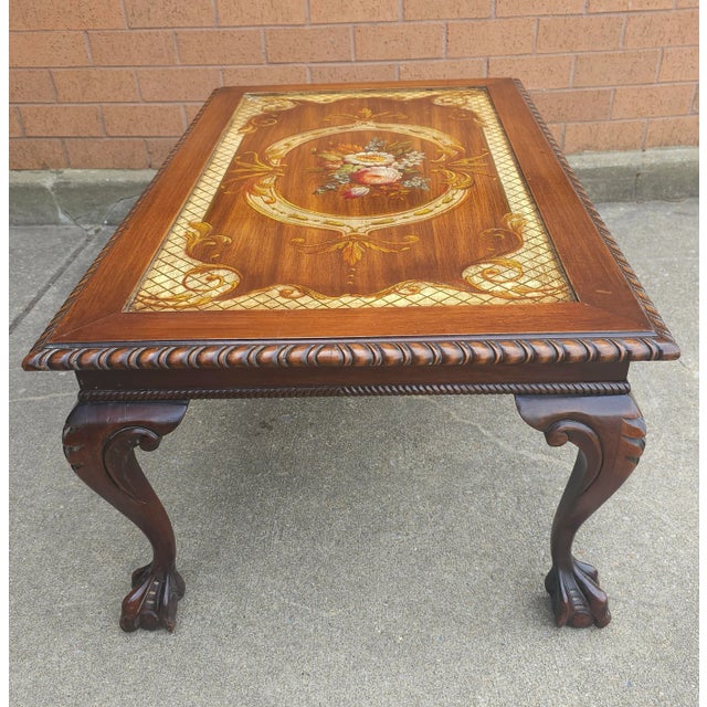Mid Century Chippendale Carved and Ornate Mahogany and Glass Inset Coffee Table with carved cabriole legs terminating with...