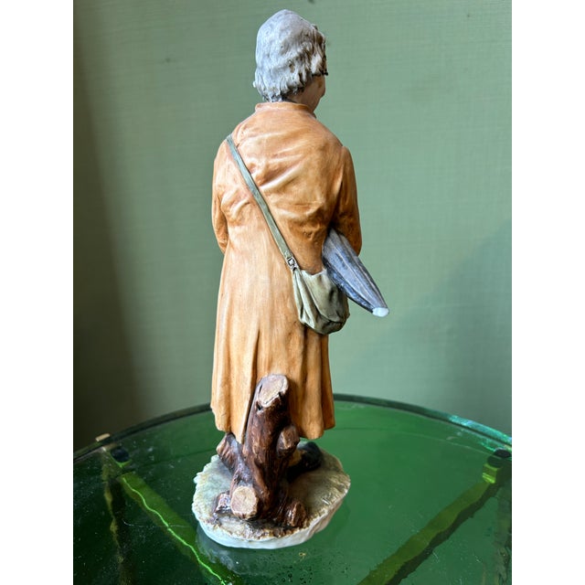 Gentleman Figurine with Hat and Umbrella from Capodimonte, 1920s, in Flawless conditions. Designed 1920 to 1949 This piece...