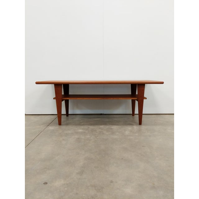 Authentic vintage mid century Danish Modern teak coffee table. This piece is in great shape overall with a few minor signs...
