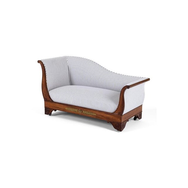 An elegant 19th Century Empire Revival sofa in walnut of wonderful proportions and splendid curves. The shapely back rest...