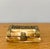 This vintage trinket box, crafted from bone and framed in warm brass, feels like something discovered at the back of a...