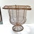 A late 19th-century French pedestal urn handcrafted from intricately twisted and woven wire. The elegant flared rim,...