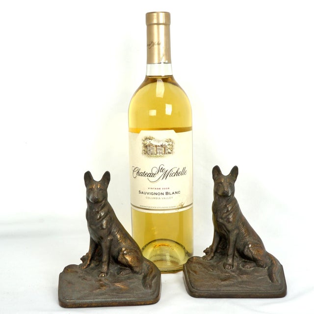 A gorgeous antique pair of heavy, deeply cast iron bookends featuring beautifully detailed German Shepherd dogs. They...