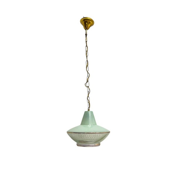 French pendant lamp from the 1950s in a saucer-shaped design made of mint green glass with subtle graphic white lines and...