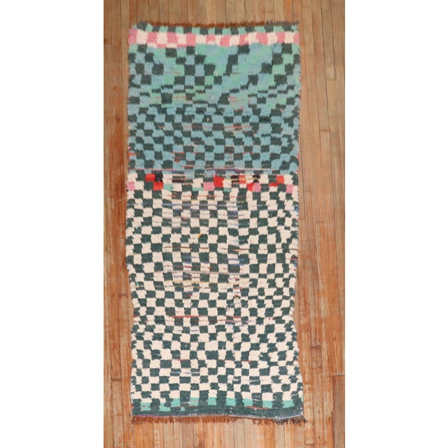 Mid 20th century moroccan small runner with the ever recurring archetypical checkerboard design made in this case from...
