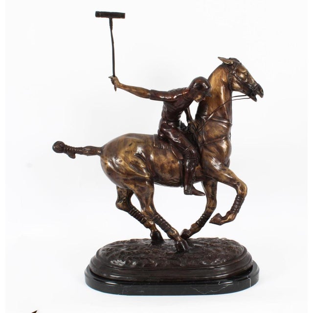 This is a handsome bronze sculpture of a polo player on his horse galloping towards the ball at high speed, dating from...