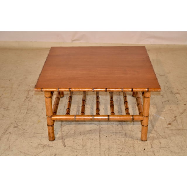Circa 1920's French faux bamboo coffee table made from cherry. The top is made from nicely grained cherry and the top is...