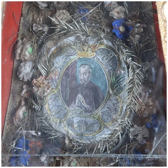 DETAILS An early, antique obelisk shaped relic display cabinet from Italy. The interior is mounted with a small portrait...