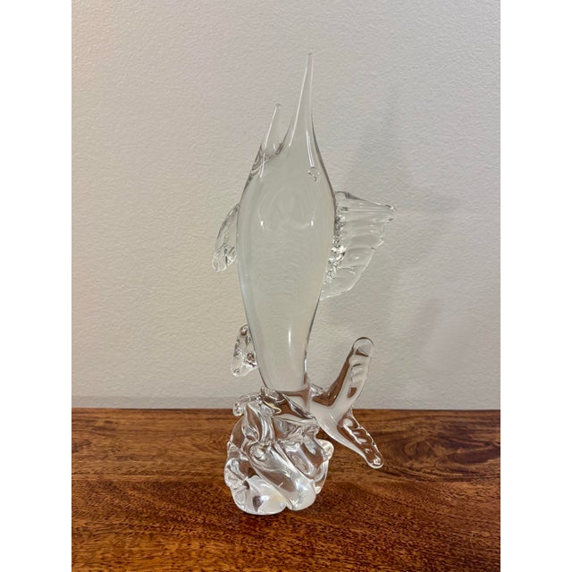 A striking vintage 1970s Murano blown glass marlin sculpture, depicting the fish dramatically leaping from stylized ocean...