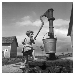 A Girl Taking Water from a Well, 1930, Photographic Print For Sale