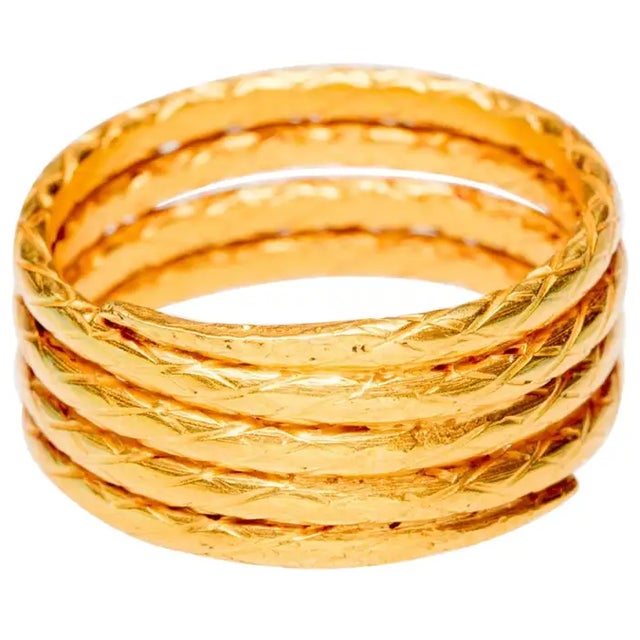 22K gold, hand - tooled coil band. The ring has 4 coils with a hand-tooled design in the gold. Ring size is 8.5.