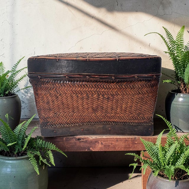 An exceptional, finely engineered mid-century tribal tayaan storage basket crafted by the Bontoc people of the Cordillera...