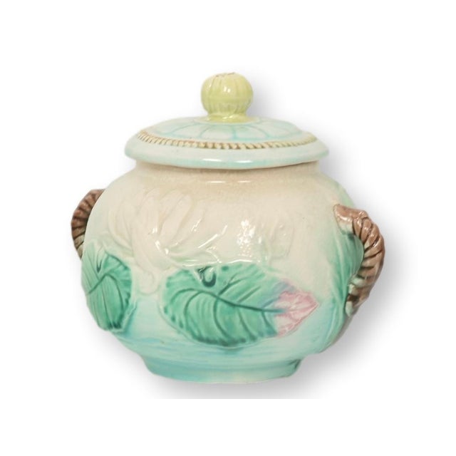 Victorian English majolica pond lily sugar bowl, circa 1880. This sculptural sugar bowl features a rounded form modeled...