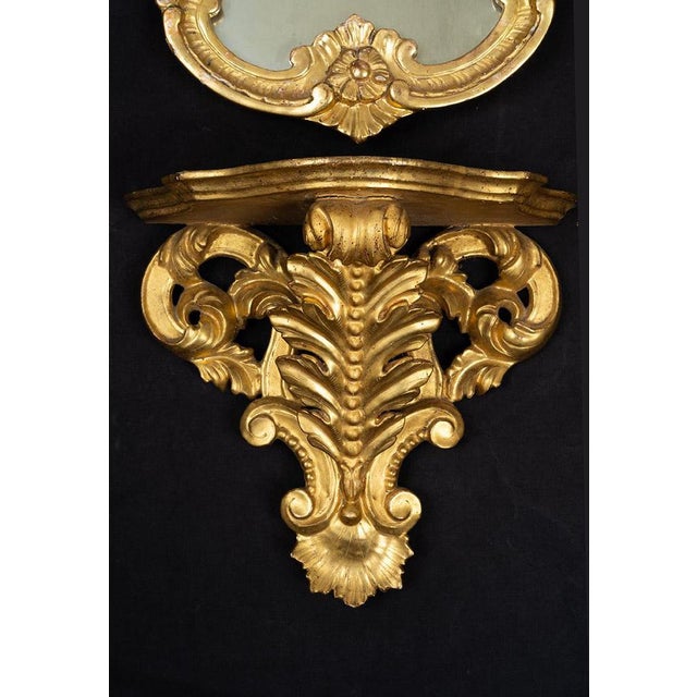 A pair of Louis XV-style mirror-topped shelves dating from the second half of the 19th century. The mirrors feature a...