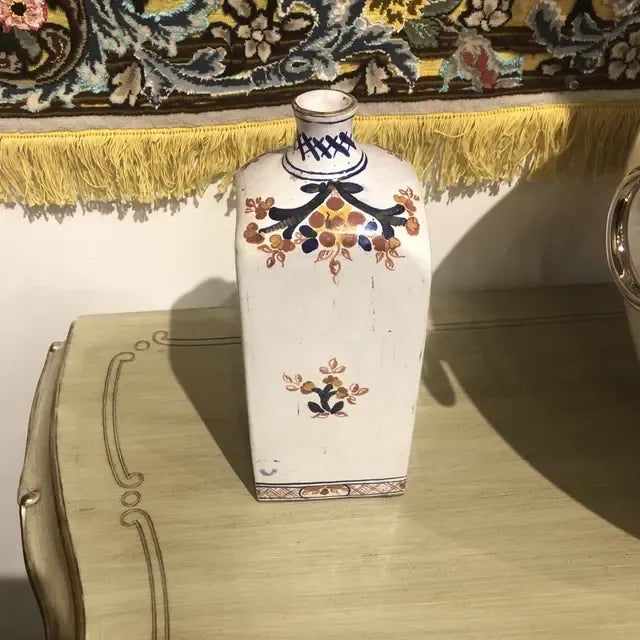 Handpainted ceramic bottle in an ivory color with blue, terracotta and yellow colors. Created in Italy. Can be a great...
