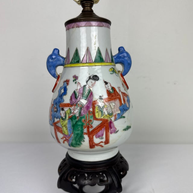 Darling little Famille Rose lamp on stand. Depicting a court scene and fantastic colors. The antique face was broken at...