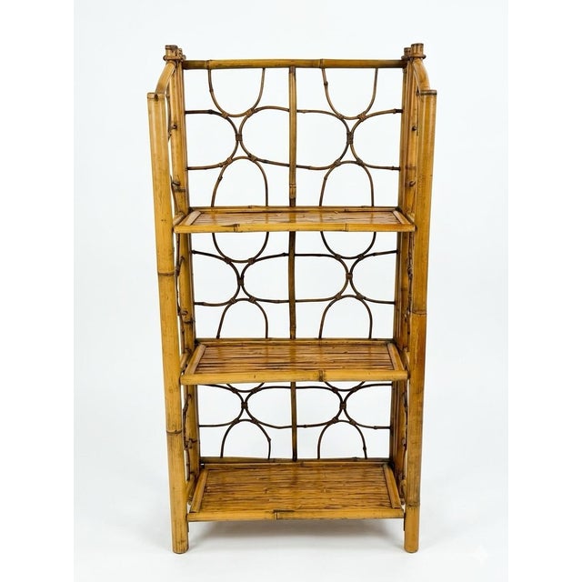 This is a stunning vintage 3-tier bamboo and rattan folding etagere, bookshelf featuring a warm, tortoiseshell, "burnt...