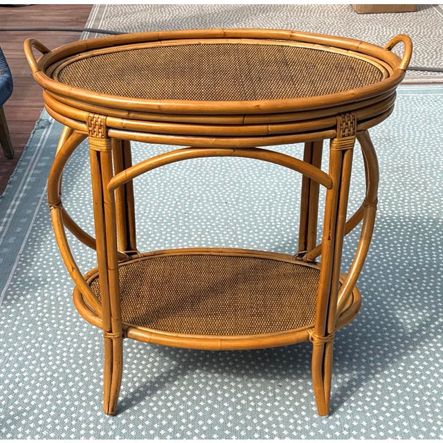 Vintage Bamboo & Rattan Bar Cart Charming two-tier bar cart in the style of McGuire. Featuring a circular bamboo frame...