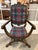 Striking antique Savonarola-style armchair with a curving X-form frame, carved foliate details, tall finial-topped back,...