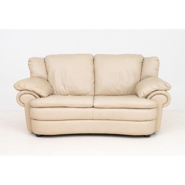 Modern Beige Leather Upholstered Two-Seat Sofa. 33" H x 66" W x 37" D; seat: 17" H. Provenance: From a Long Island, New...