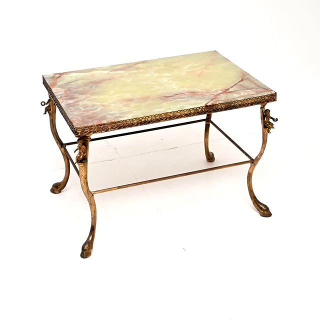 A fabulous antique French brass and Onyx coffee table, dating from around the 1920’s. This is of outstanding quality, it...
