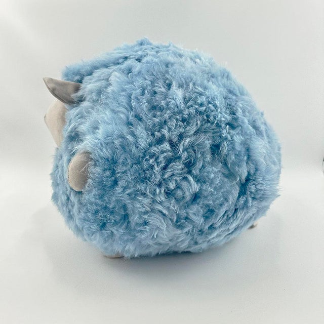 Beyond its irresistibly cuddly charm! This blue plush sheep adds a touch of whimsy to any space—perfect for a nursery, a...