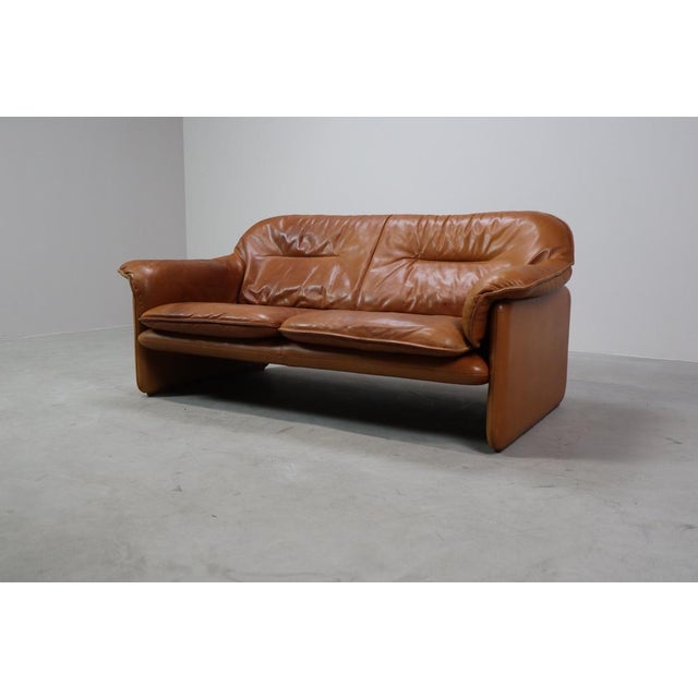 DS-16 leather sofa by De Sede, Switzerland, dating from the 1970s. This three-seater showcases the signature rounded...