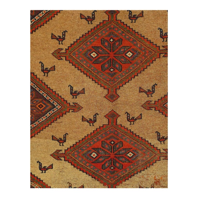 Striking geometric patterning displayed in perfect symmetry graces this antique Persian rug. Rust borders, embellished...