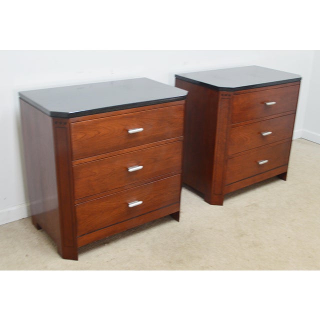Pair of Nightstands by Stickley. Store item #558. They features three dovetailed drawers and stone top.
