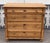 This lovely little chest of drawers has some interesting design features as well as a warm honey color, an attractive...