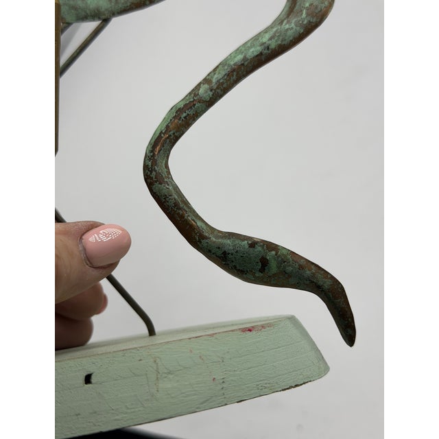 This is a wonderful vintage mid-century metal bird sculpture, depicting a stylized long-legged wading bird—reminiscent of...