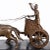 French Patinated Bronze and Black Slate Chariot Clock, late 19th century, of rounded rectangular form, surmounted by a...