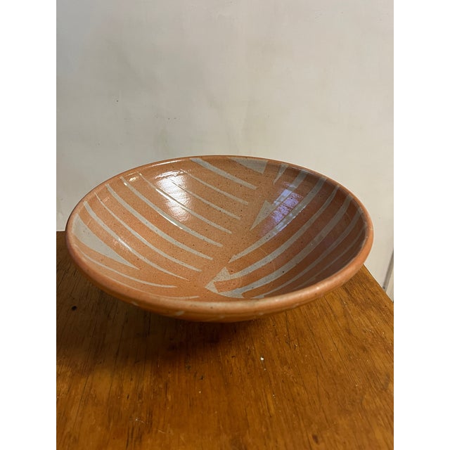 Soft peach earth tone studio pottery pedestal bowl with sweeping graphic pale gray line work great for kitchen, fruit...