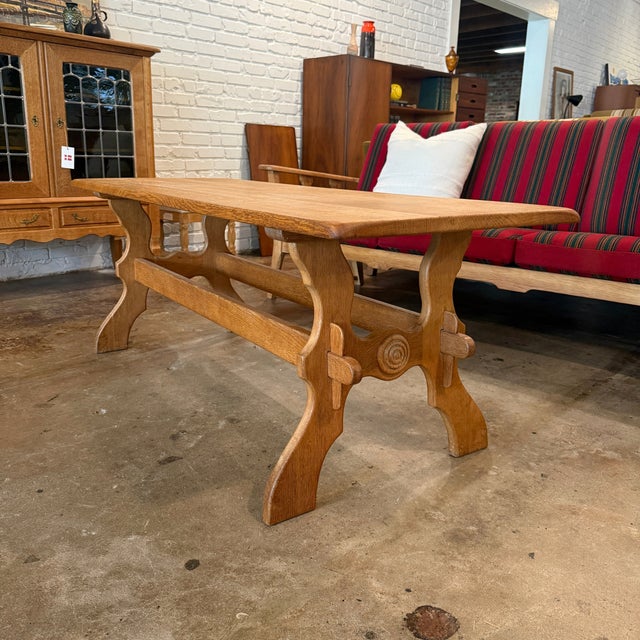 Vintage Danish coffee table in hand-carved quarter-sawn white oak attributed to designer and architect Henning Kjærnulf of...