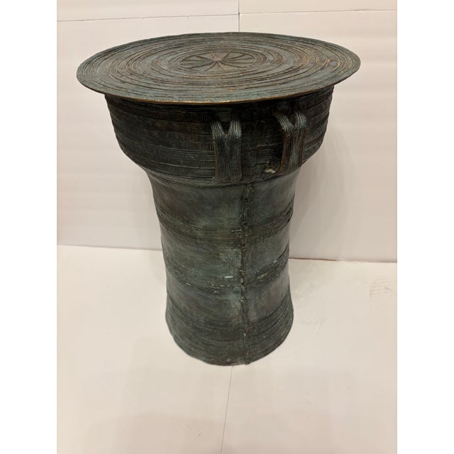 This vintage rain drum is very heavy and makes a great piece of furniture like a side table or plant stand. During it's...
