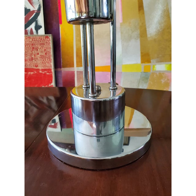An original 1970's chrome sculptural light table lamp with various settings ( the integrated on/off switch on the base can...