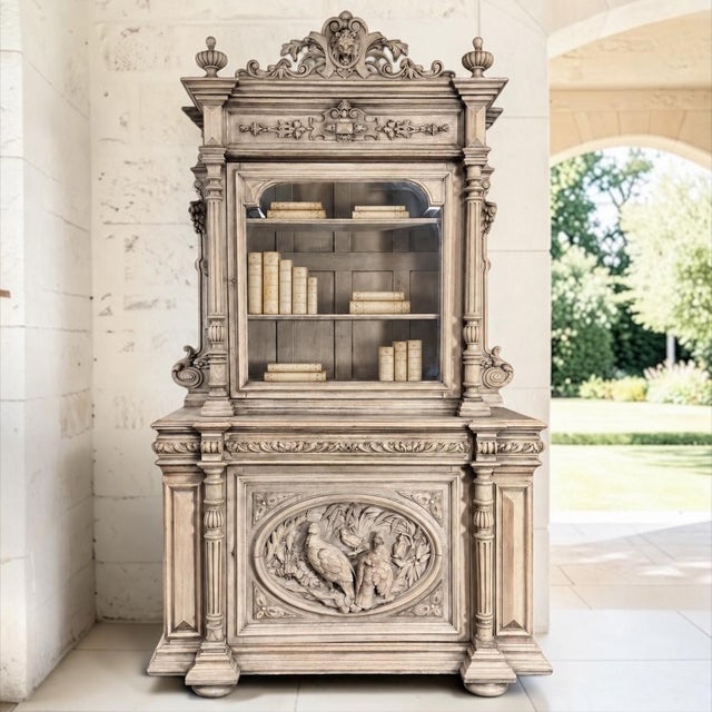 An exceptional 19th century French Renaissance Revival hunt cabinet, or bibliothèque, crafted from solid oak and...