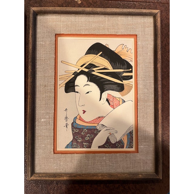 Enhance your collection with this elegant pair of Japanese ukiyo-e style woodblock prints. These pieces are attributed to...